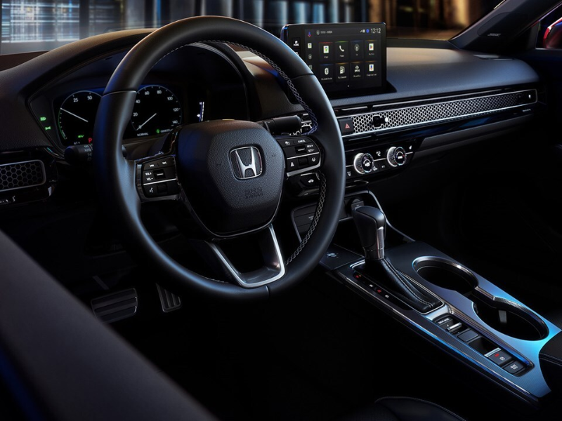 Interior of the Honda Civic sedan showing the touchscreen and digital driver display