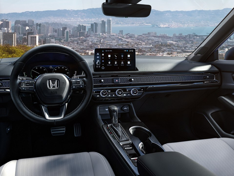 Interior of the Honda Civic sedan showing the touchscreen and gauge display